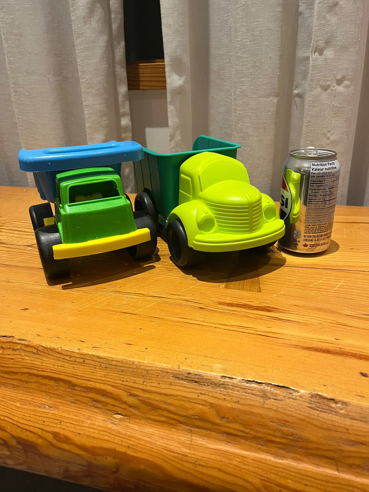 Two Plastic Medium-Sized Trucks