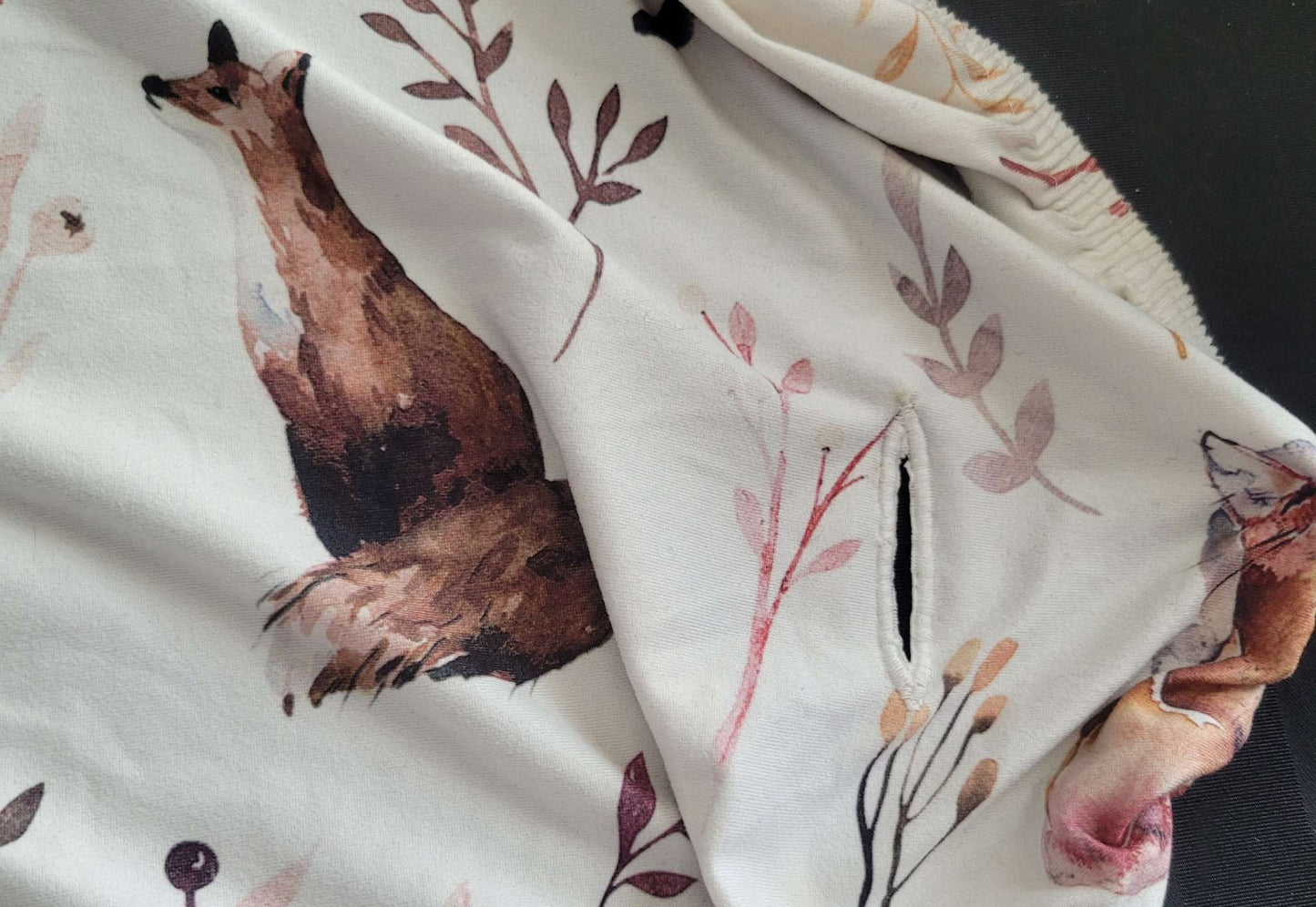 Two changing pad covers, pink and fox patterns