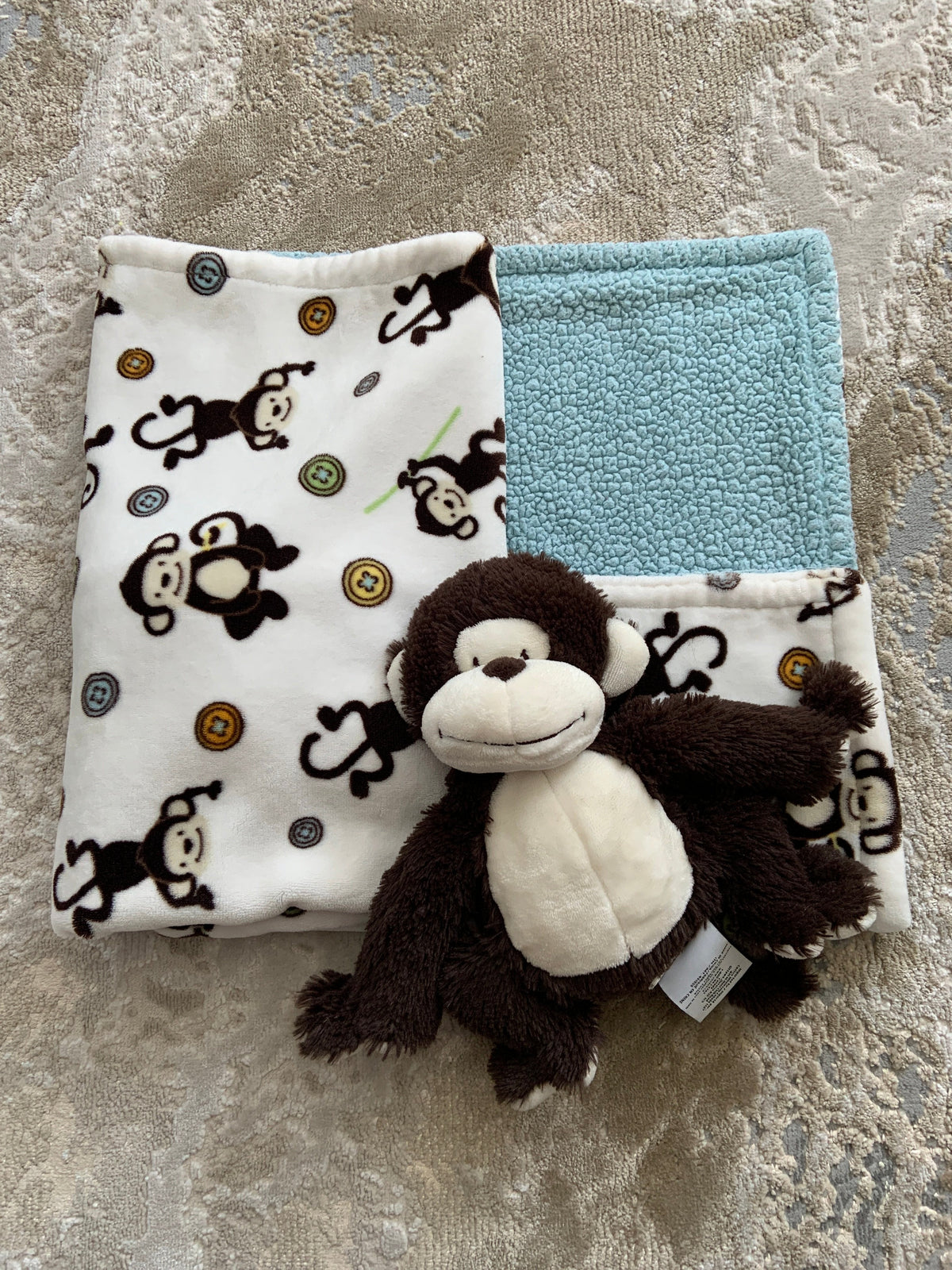 Little miracles baby blanket with its own plush Monkey toy