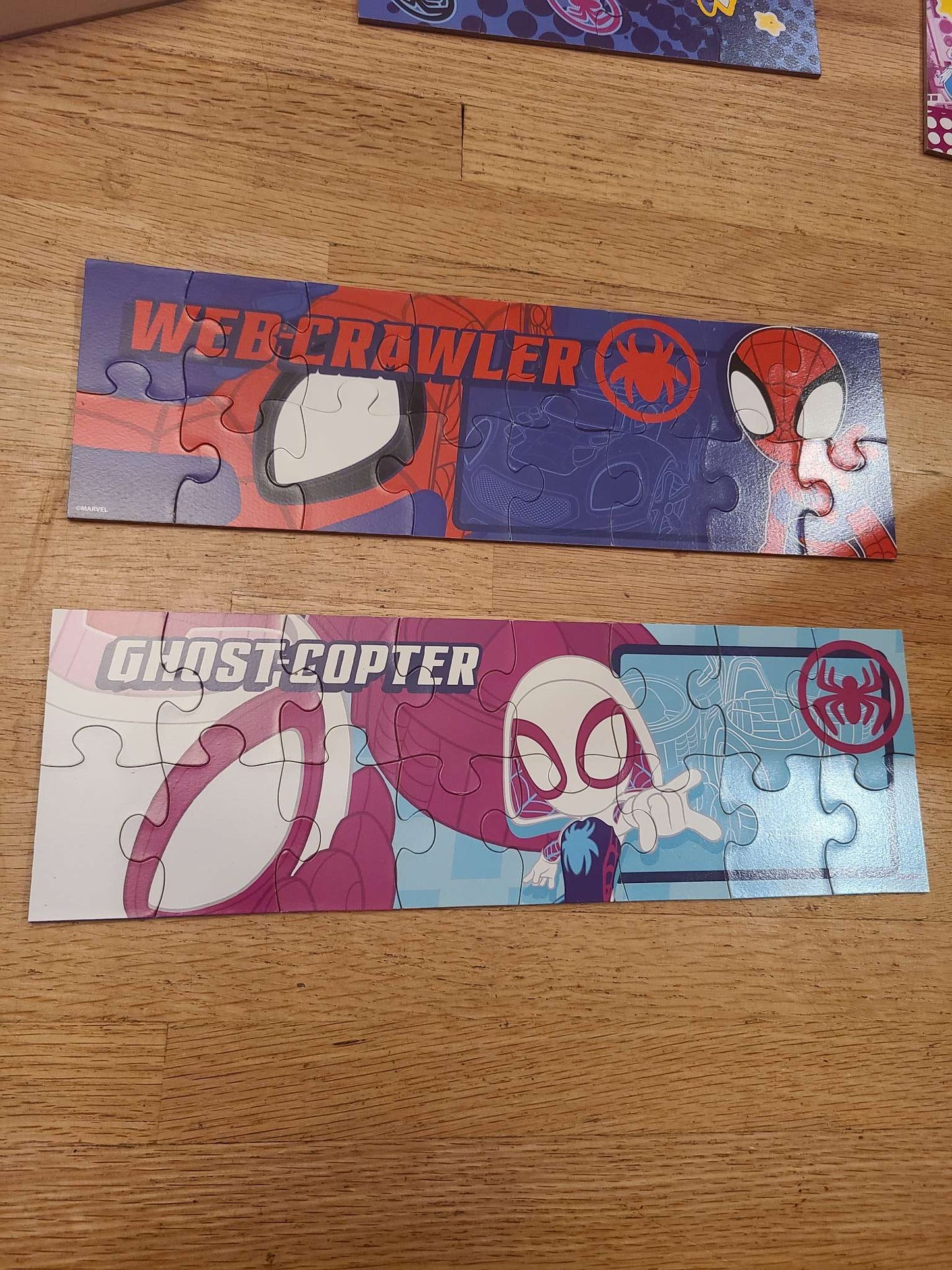 Wooden Spiderman puzzles.. 7 puzzles with case