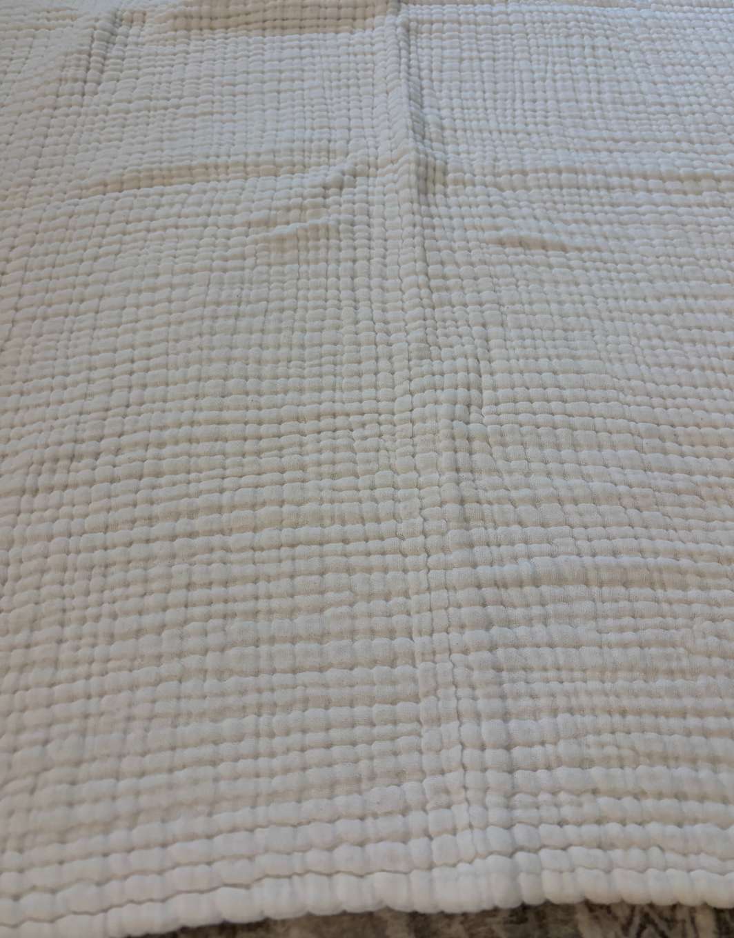 White muslin baby blanket