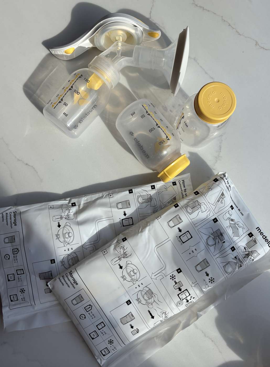 Medela hand pump and milk bags