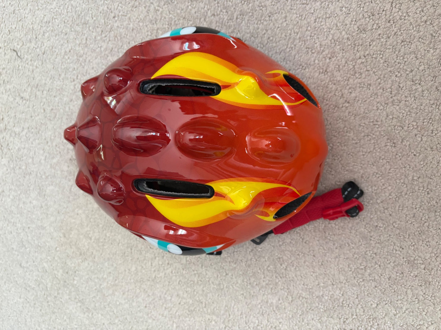 New - dinosaur bike helmet, never used, retails $30, 50-54cm head circumference
