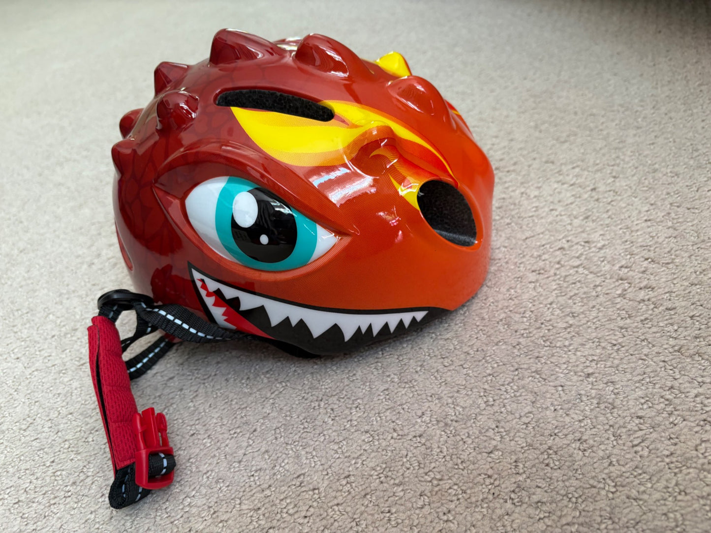 New - dinosaur bike helmet, never used, retails $30, 50-54cm head circumference