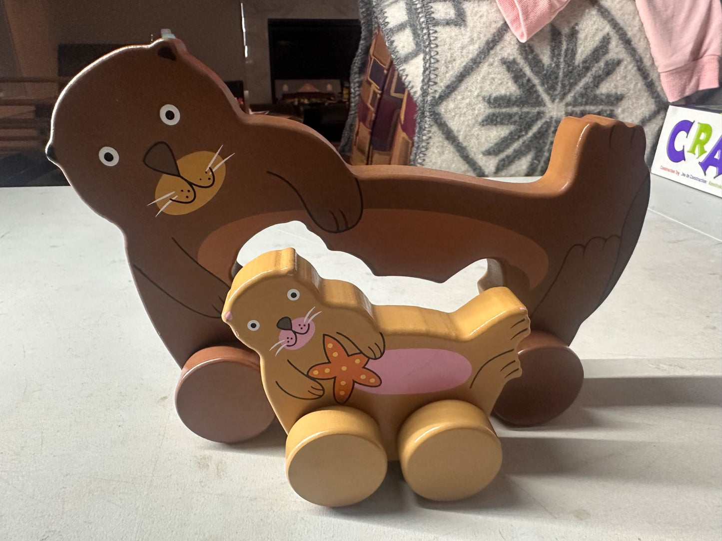 Big and little roly poly otter push toy