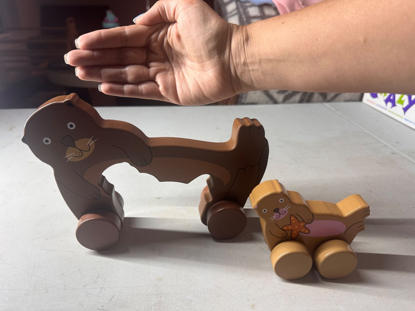 Big and little roly poly otter push toy