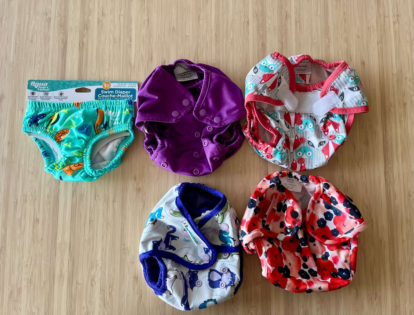 Cloth diaper covers (4) + swim diaper (1)