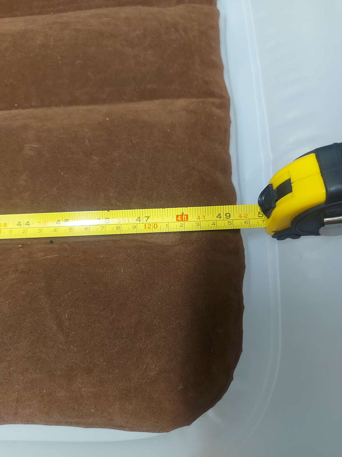 Inflatable travel bed with safety bumpers