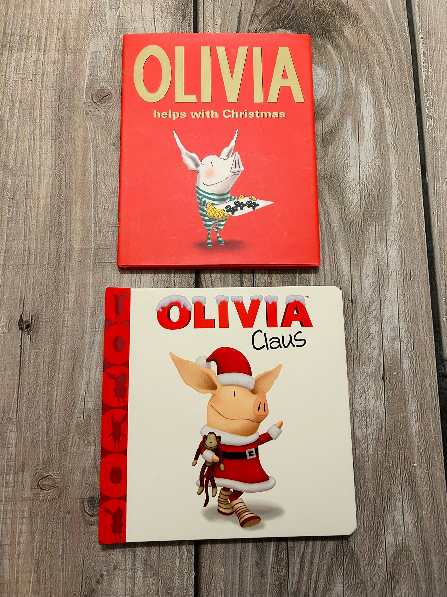 Olivia Claus & Olivia helps with Christmas hardcover books, EEUC