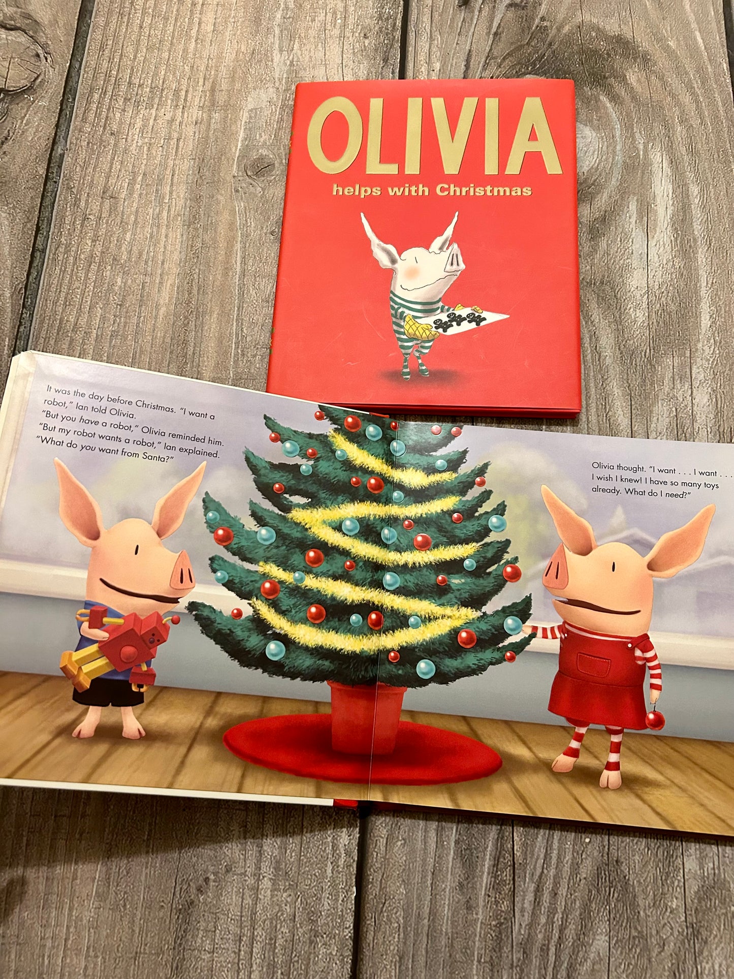 Olivia Claus & Olivia helps with Christmas hardcover books, EEUC