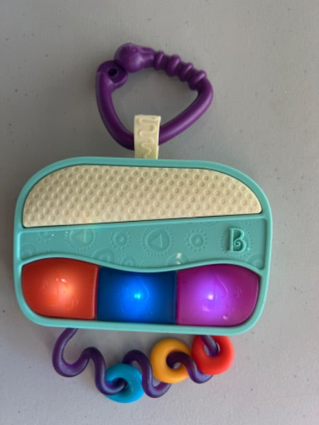 B baby piano rattler where keys light up no sound