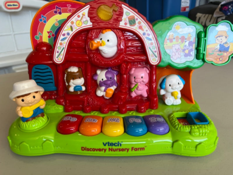 V tech nursery farm learning toy.