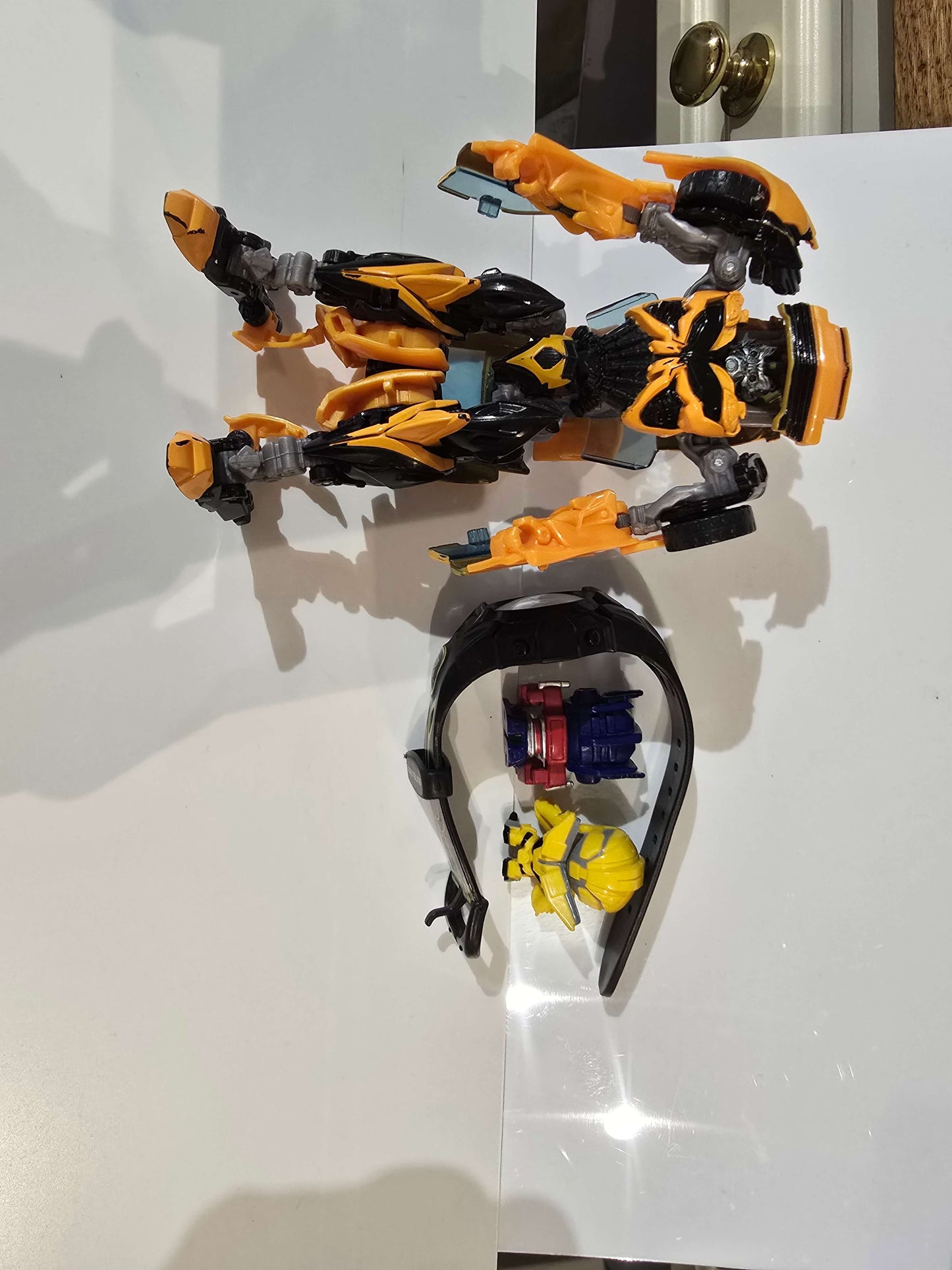 Transformers watch, figurines and Bumblebee car that can be transformed into bot