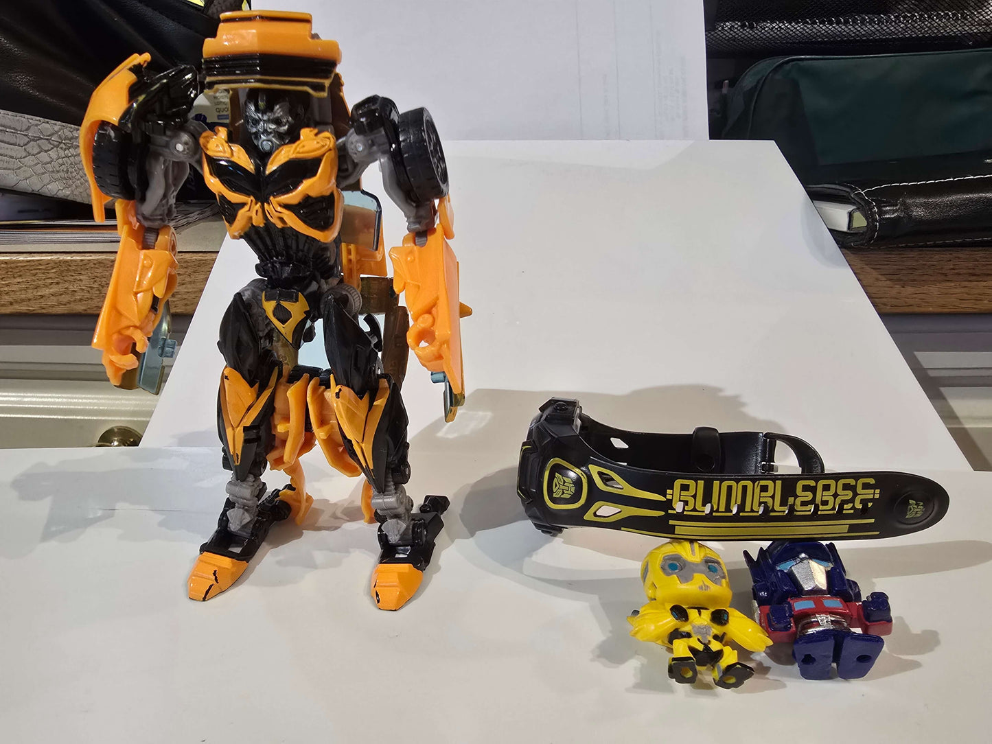 Transformers watch, figurines and Bumblebee car that can be transformed into bot