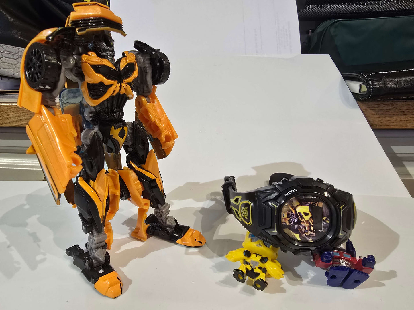 Transformers watch, figurines and Bumblebee car that can be transformed into bot