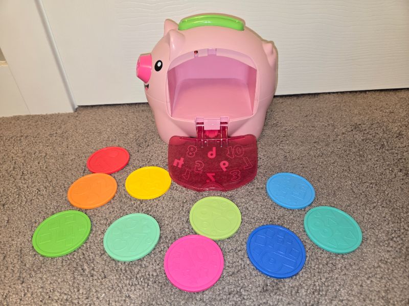 Piggie bank toy. English and French words