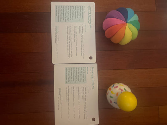 Lovevery tummy time wobbler and organic cotton rainbow ball