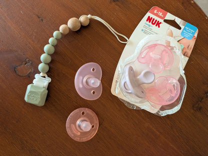 NUK pink soothers and LOULOU Lollipop soother clip