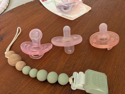 NUK pink soothers and LOULOU Lollipop soother clip