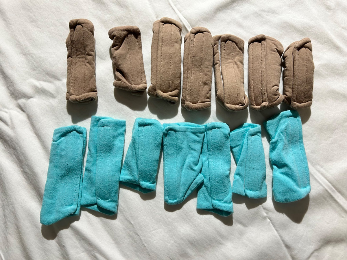Two sets of Pavlik harness padded covers