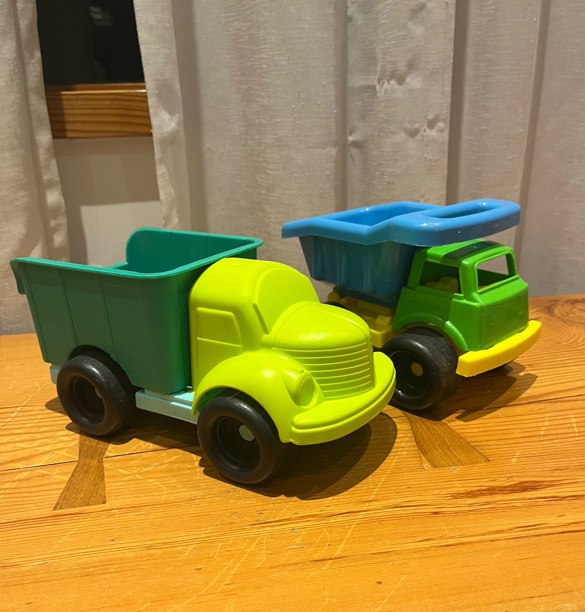Two Plastic Medium-Sized Trucks