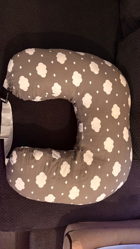 Nursing pillow with strap