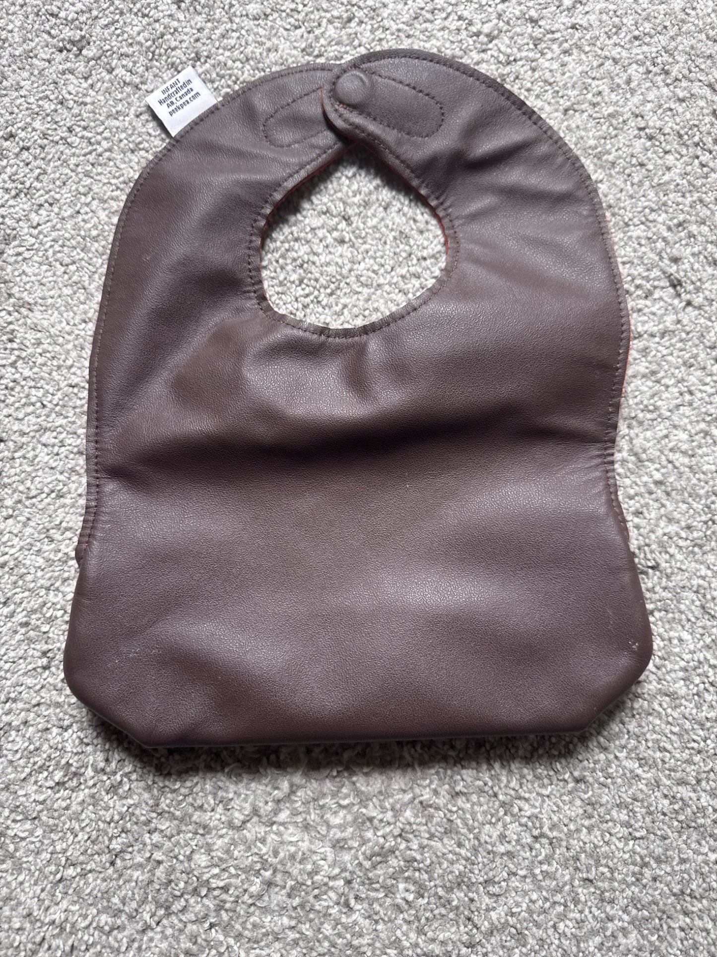 Peek pea leather bib