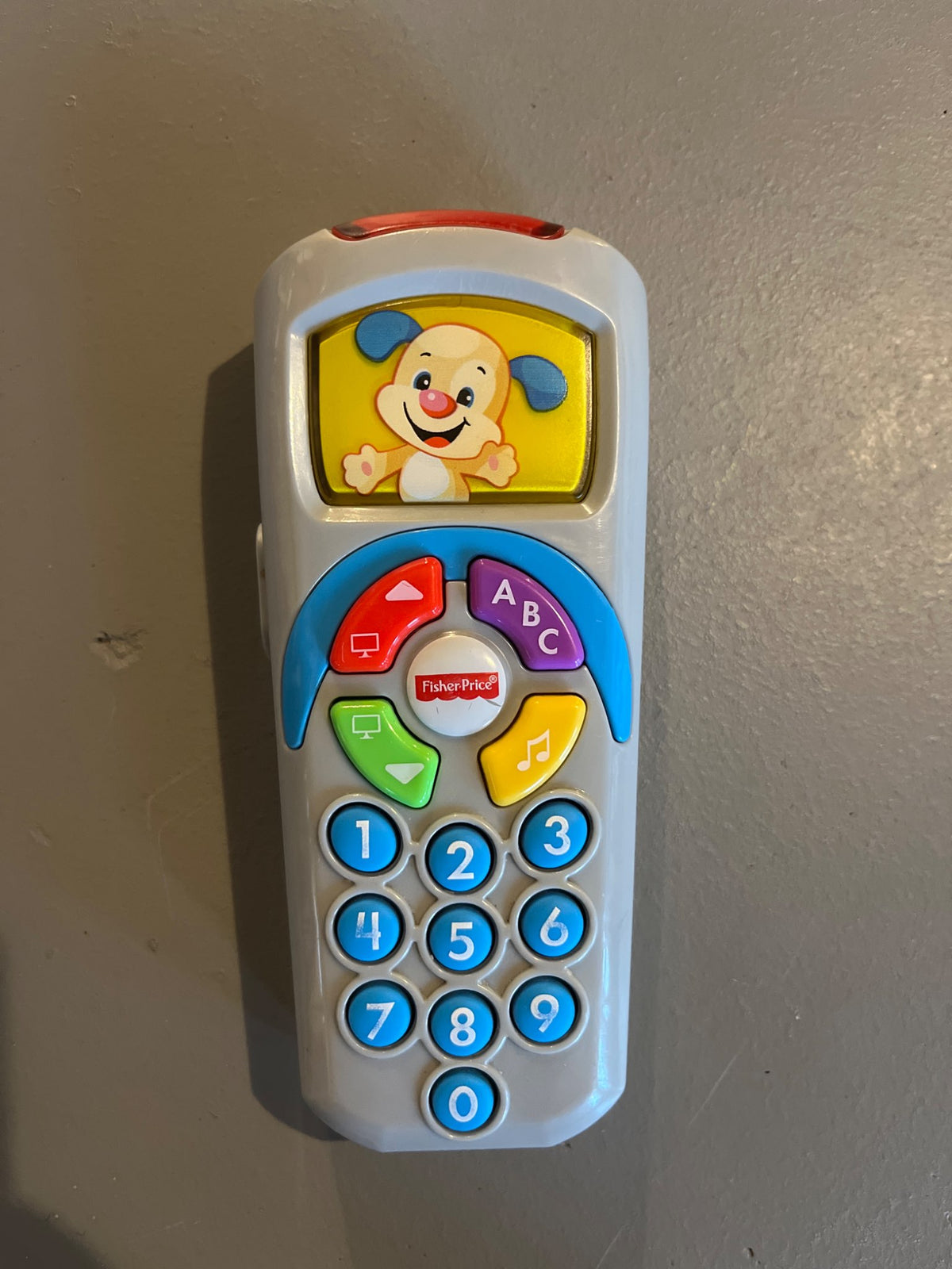 Fisher Price - Laugh & Learn Puppy’s Remote Pretend TV Control with Music & Lights