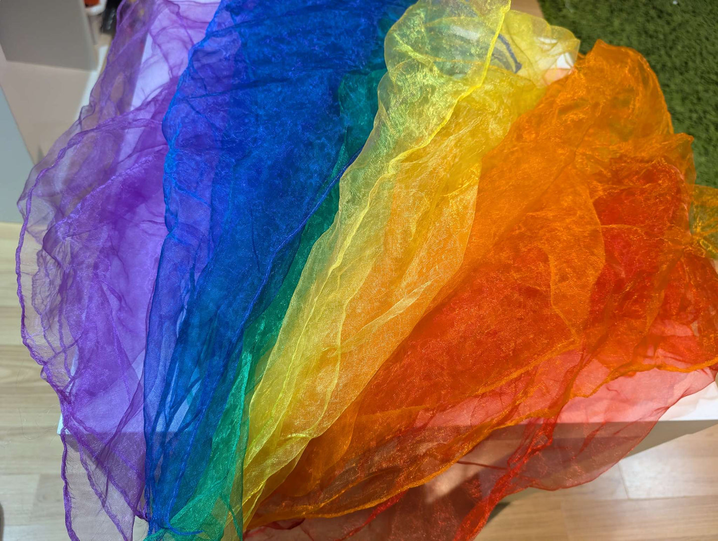 Juggling rainbow scarves