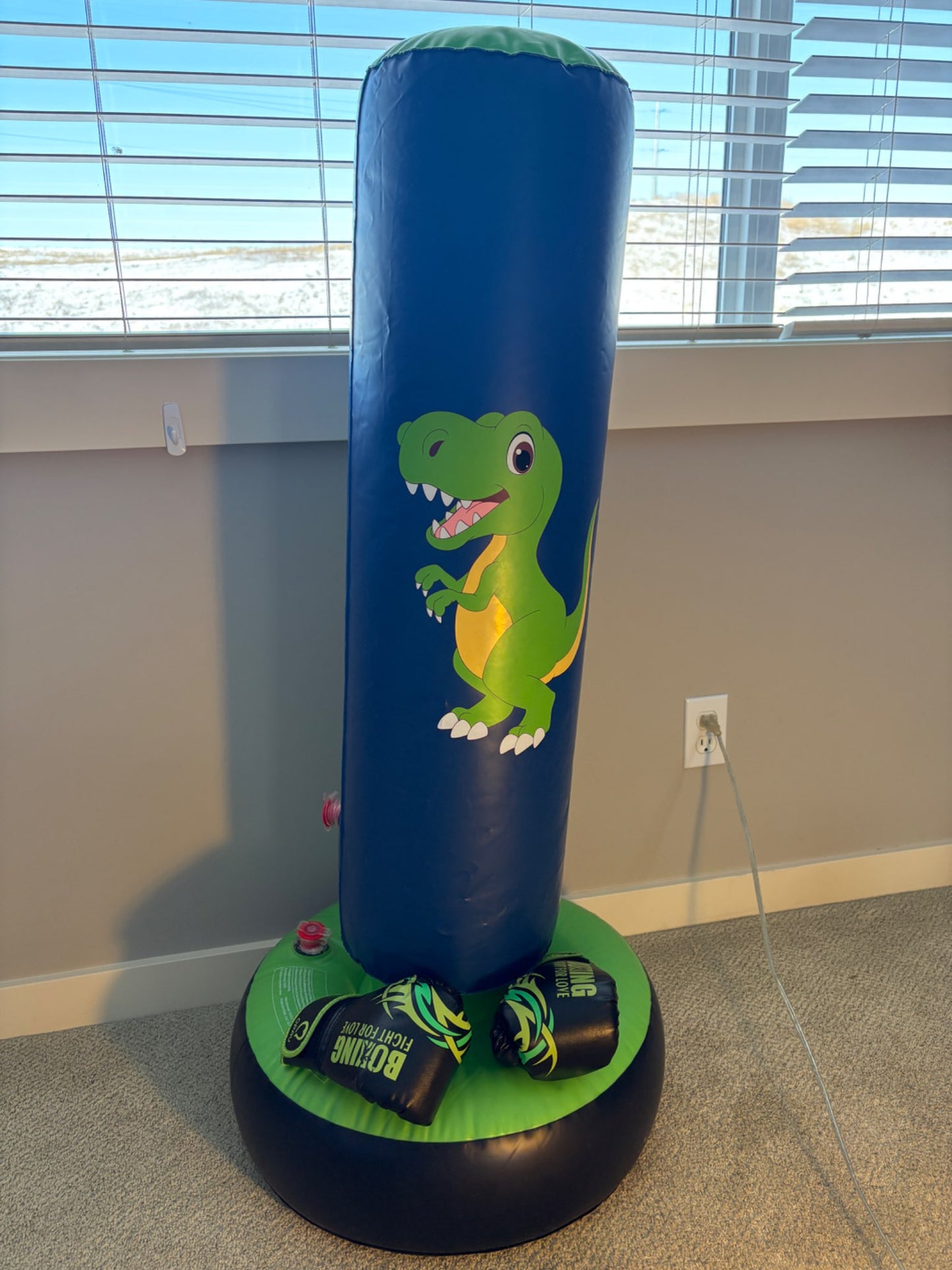 Dinosaur blow up punching bag with gloves