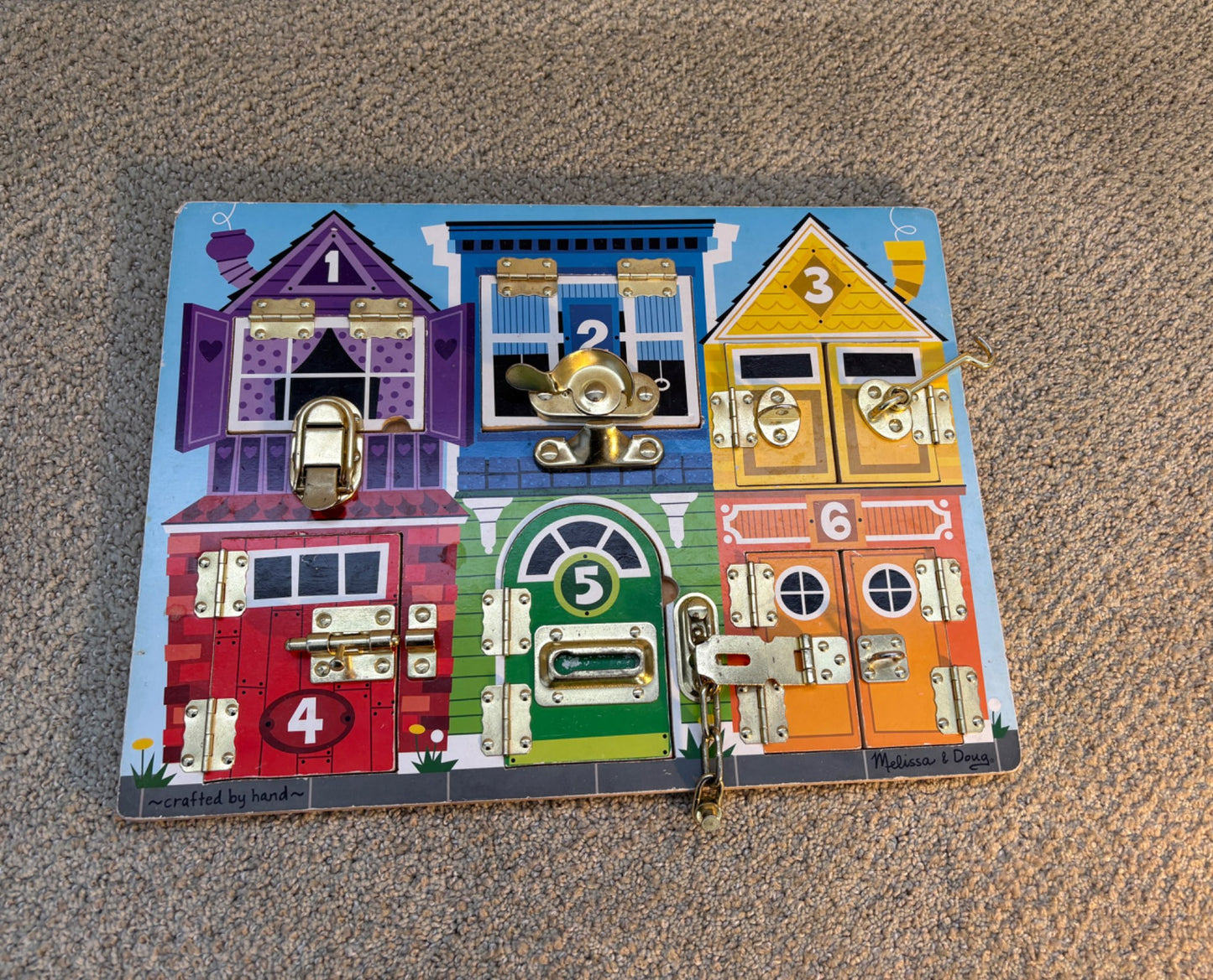 Melissa and Doug latches board