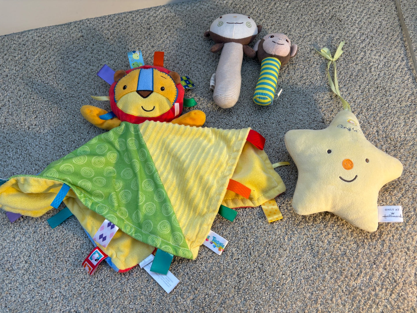 Infant toy bundle: tagg lion, musical star, rattles