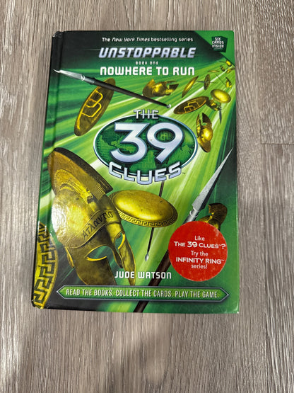 Two of the famous 39 Clues books The Maze of Bones and Nowhere to Run