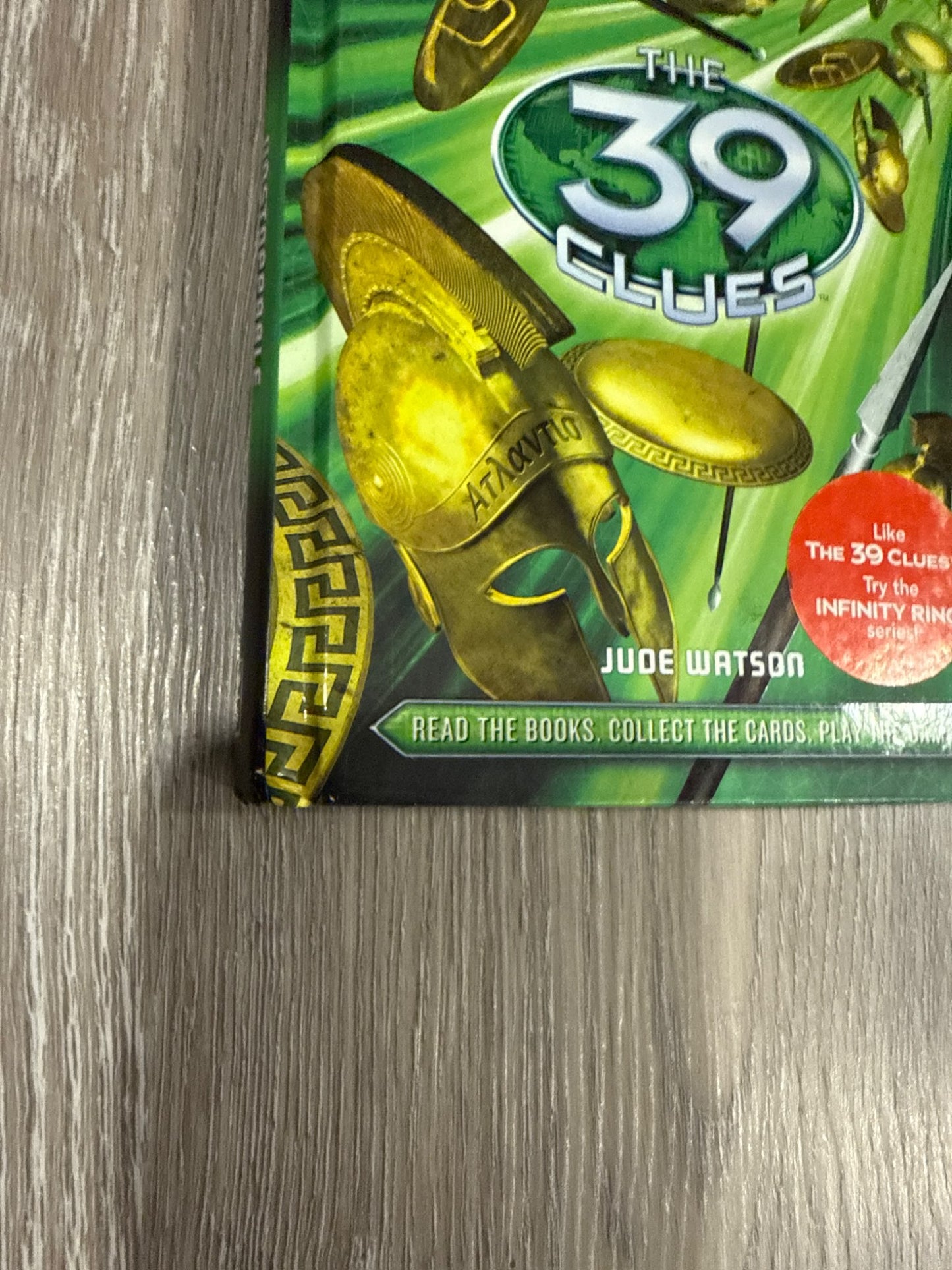 Two of the famous 39 Clues books The Maze of Bones and Nowhere to Run