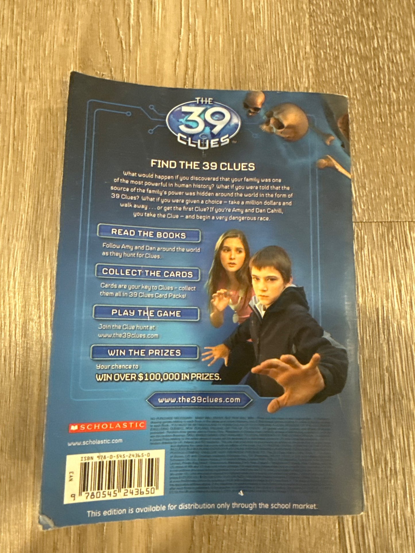 Two of the famous 39 Clues books The Maze of Bones and Nowhere to Run