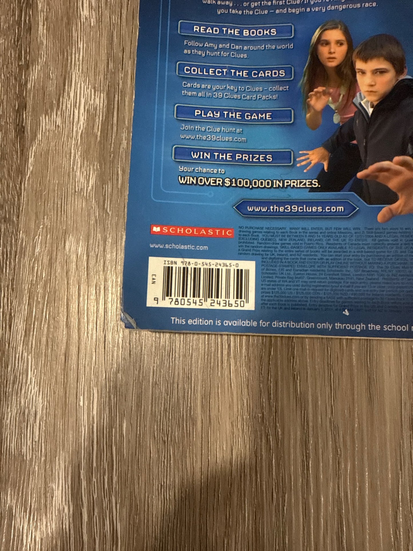 Two of the famous 39 Clues books The Maze of Bones and Nowhere to Run