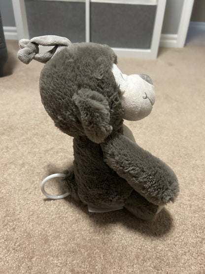 Musical pull toy monkey