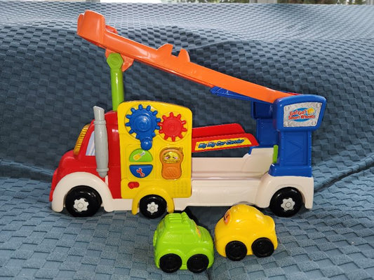 Used Vtech kids toy truck with ramp and 2 cars