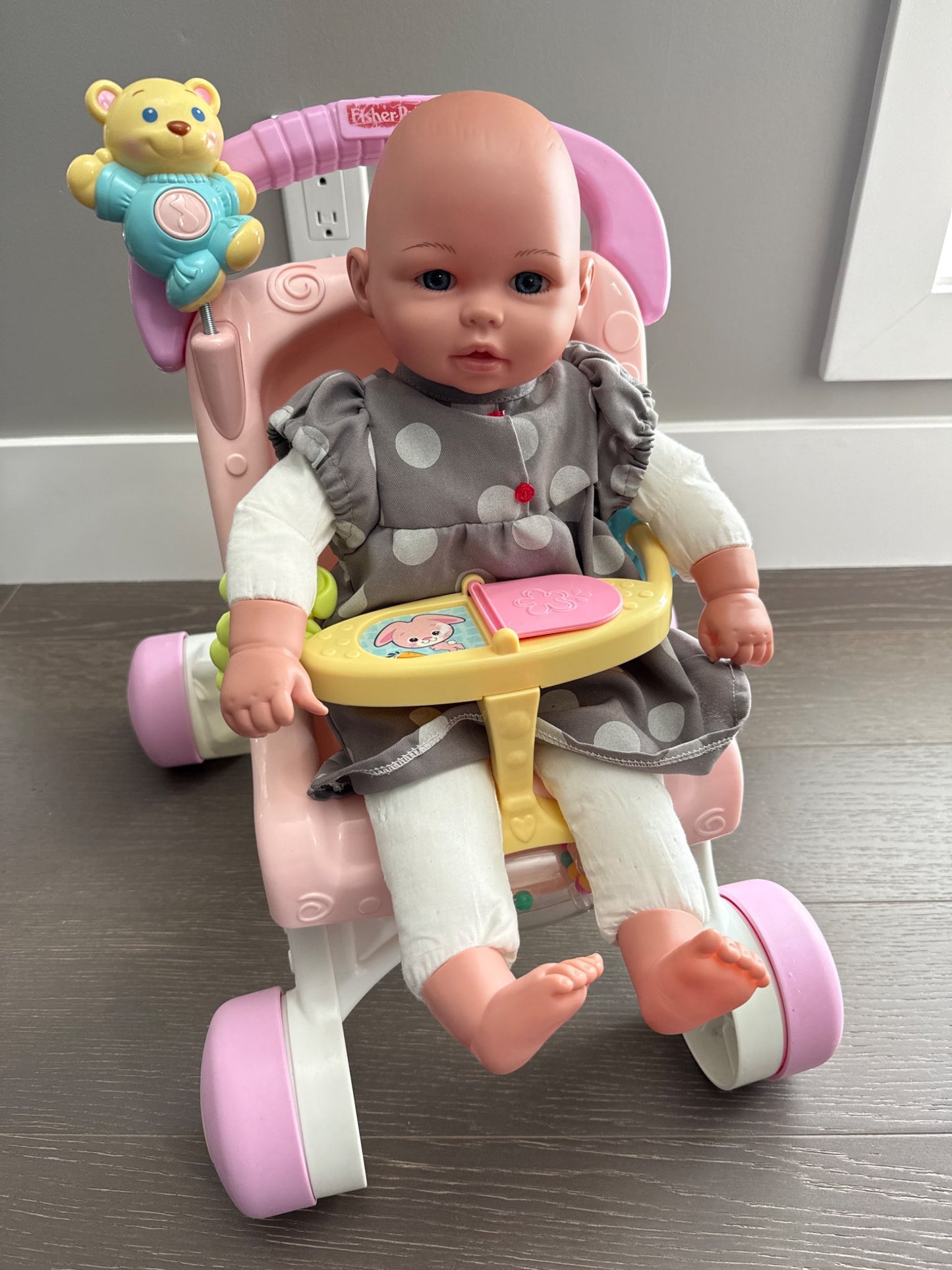 Fisher Price stroll along walker with a baby doll
