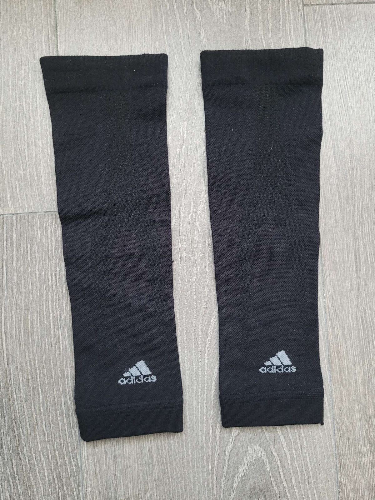Pair of Adidas soccer shin pad covers