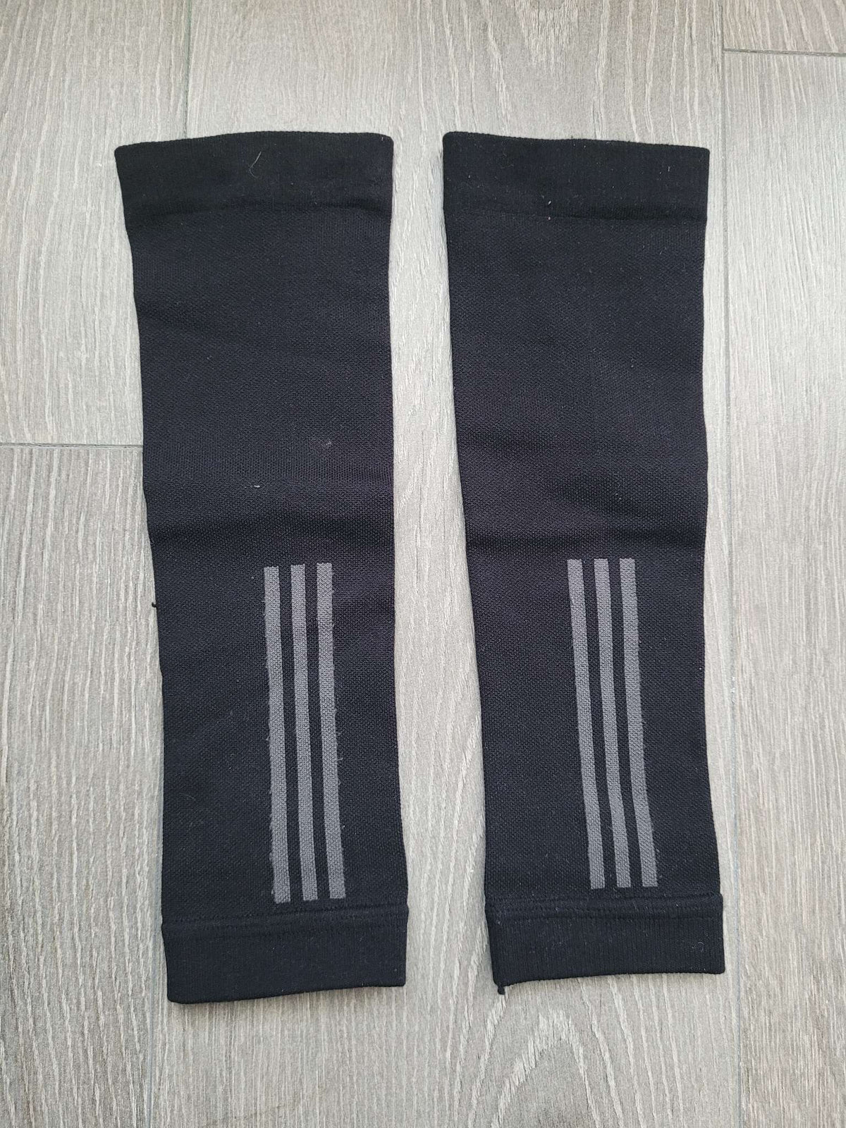 Pair of Adidas soccer shin pad covers