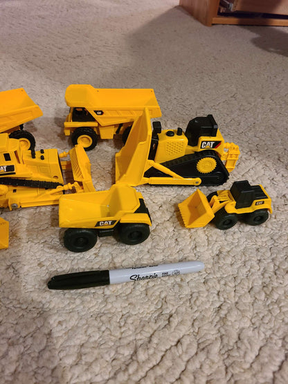 Assorted cat construction trucks