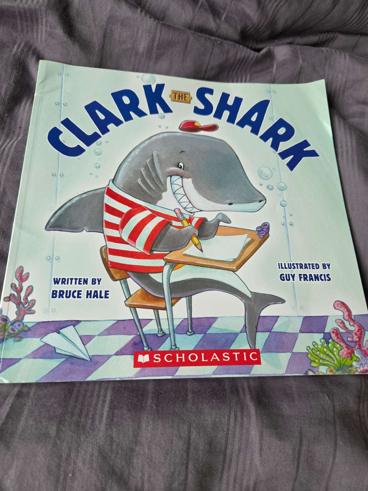 Scholastic books ( up, up down and Clark the shark)