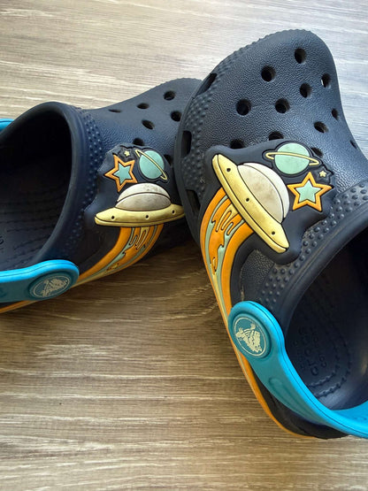 Light-up Space Crocs size 7; MSRP $54.99, Shoes 7 (Walkers:12-24 mth)