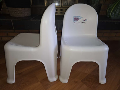 2 white little chairs