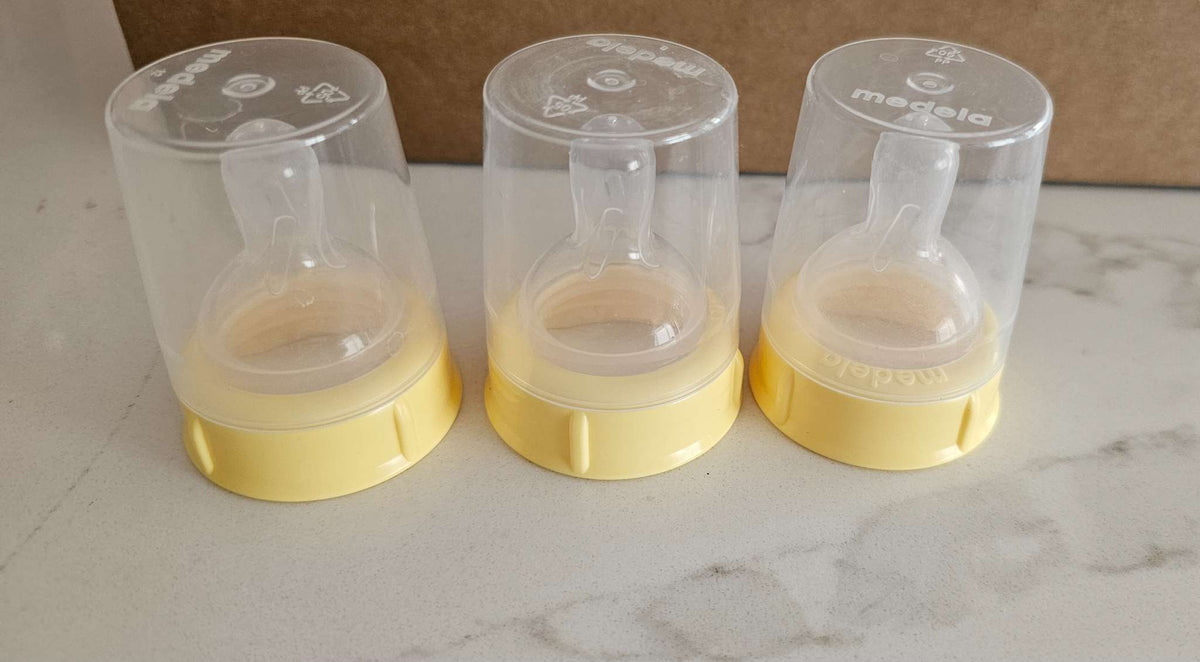 New Medela Bottle Nipples with caps