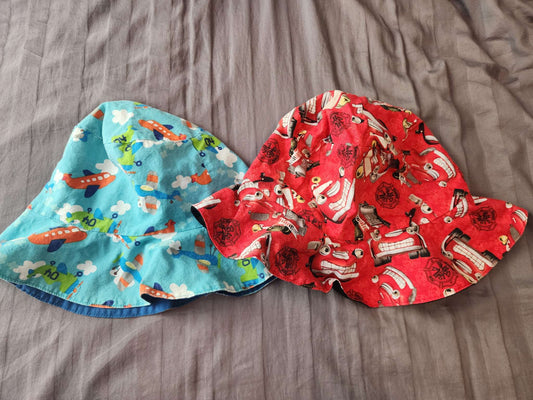 2 over sized sun hats size 4-6- fire trucks & planes