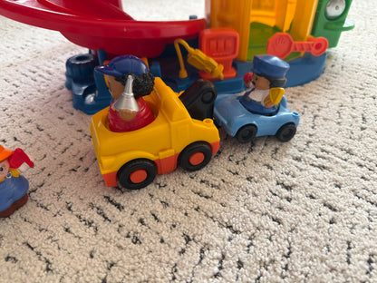 Little people large  parking garage with car elevator and cars