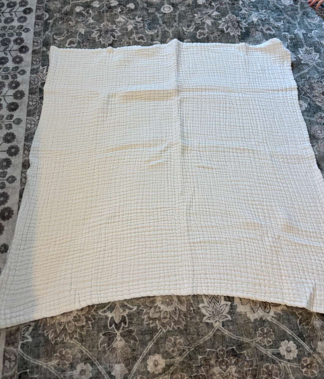 White muslin baby blanket