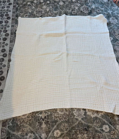 White muslin baby blanket